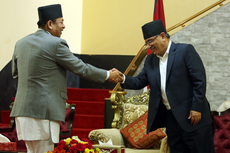 Prime Minister Pushpa Kamal Dahal (right) greets Vice-President Nanda Bahadur Pun at a function at the Sheetal Niwas, on Sunday, August 14, 2016. Pun was a member of Dahal's party before he was elected the Vice-President. Photo: RSS