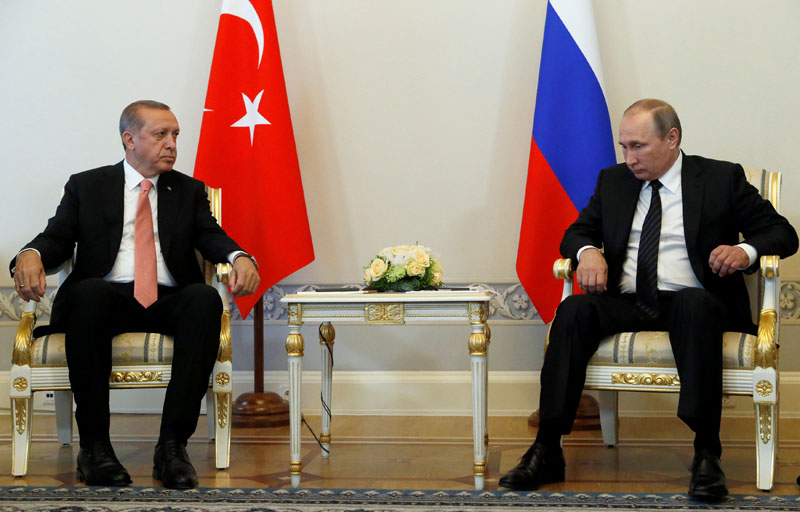 Russian President Vladimir Putin and Turkish President Tayyip Erdogan attend their meeting in St. Petersburg, Russia, on Tuesday, August 9, 2016. Photo: REUTERS