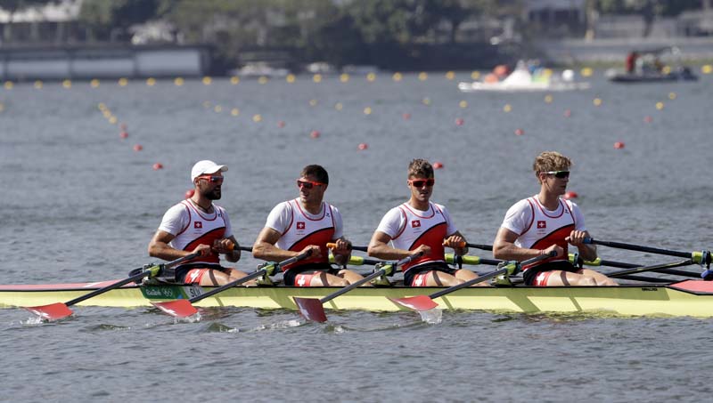 Nico Stahlberg, Augustin Maillefer, Roman Roeoesli, and Barnabe Delarze, of Switzerland, compete in the men's quadruple scull heat heat during the 2016 Summer Olympics in Rio de Janeiro, Brazil, on Saturday, August 6, 2016. Photo: AP