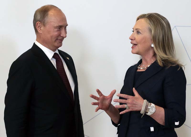 File- Russian President Vladimir Putin meets US Secretary of State Hillary Rodham Clinton on her arrival at the APEC summit in Vladivostok, Russia on September 8, 2012.