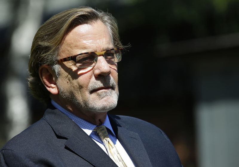 FILE - Attorney John Henry Browne listens to questions from reporters at Joint Base Lewis-McChord in Washington state, on June 5, 2013. Photo: AP