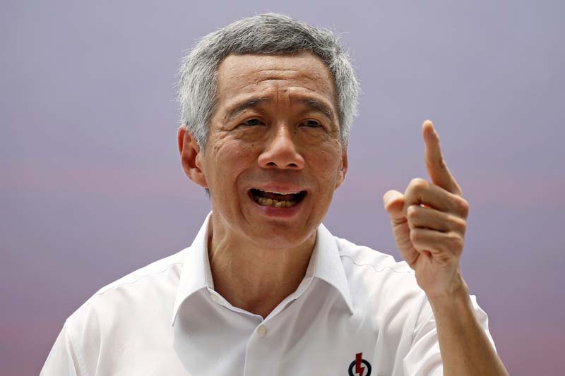 Secretary-General of the ruling People's Action Party (PAP) Lee Hsien Loong speaks at a lunchtime rally in the central business district in Singapore on September 8, 2015. Photo: Reuters/ File