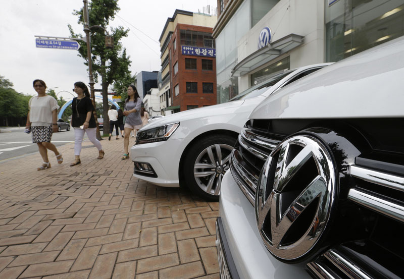 The Volkswagen emblem is seen on a vehicle in front of a dealership in Seoul, South Korea, onTuesday, August 2, 2016. Photo: AP