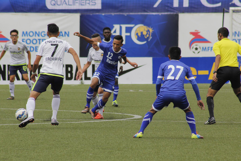 FILE- Nepal's Three Star Club (in blue) play against Mongolia's Erchim Football Club, in Ulaanbaatar, the capital of Mongolia, on Sunday, August 21, 2016. Photo: NSJF