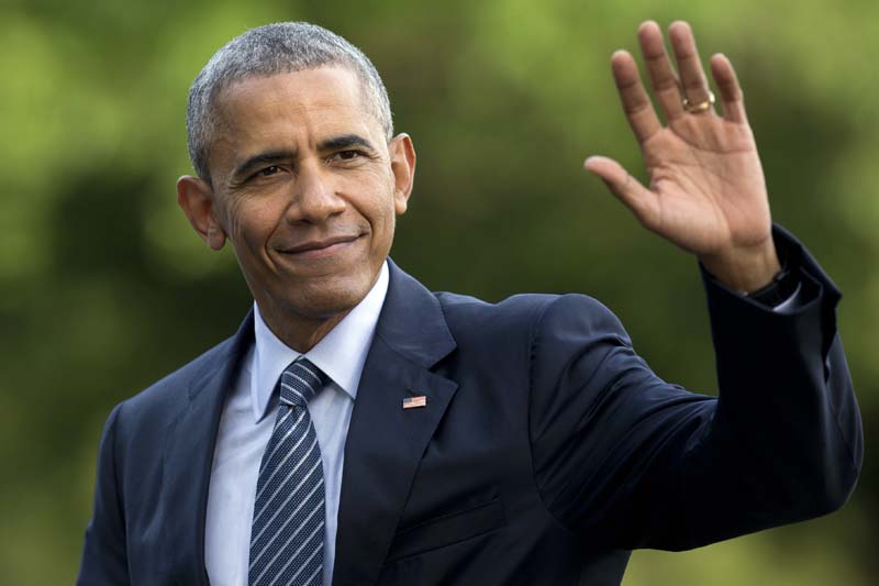 US President Barack Obama waves as he walks across the South Lawn of the White House, in Washington, as he returns from Charlotte, North Carolina where he participated in a campaign event with Democratic presidential candidate Hillary Clinton on July 5, 2016. Photo: AP