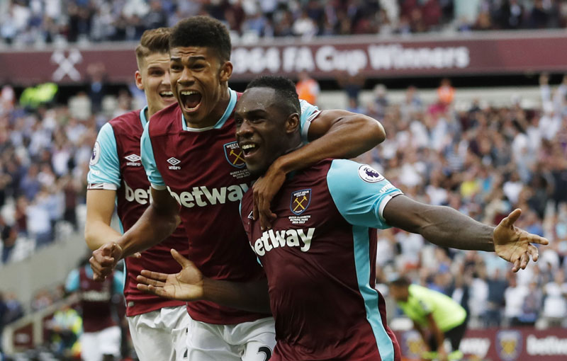 West Ham United's Michail Antonio celebrates scoring their first goal with Ashley Fletcher and Sam Byram  against AFC Bournemouth at London Stadium on August 21, 2016. Photo: Action Images via Reuters