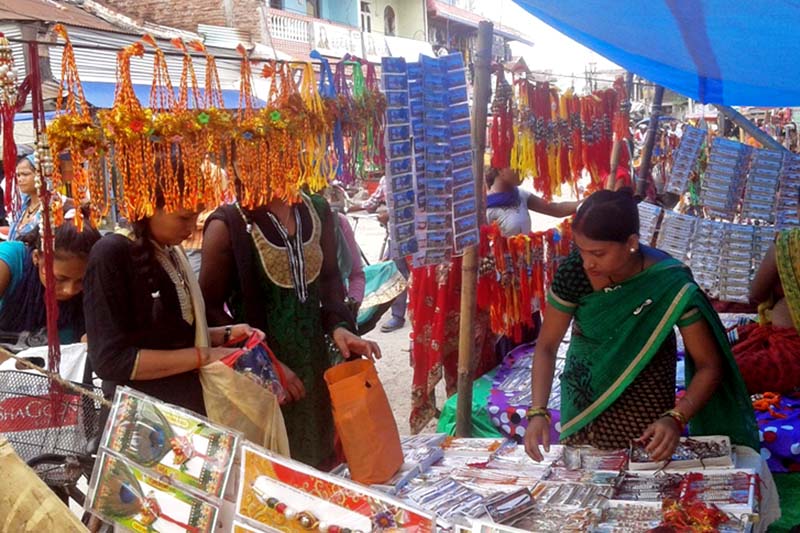Women buy rakhis for their brothers on the eve of Janai Purnima in Inaruwa, the district headquarters of Sunsari, on Wednesday, August 17, 2016. Photo: RSS