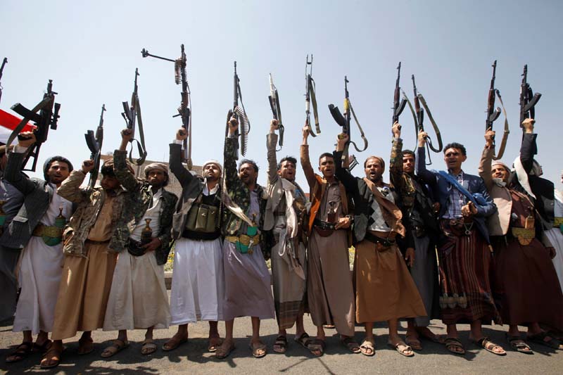 File- Armed men loyal to the Houthi movement wave their weapons as they gather to protest against the Saudi-backed exiled government deciding to cut off the Yemeni central bank from the outside world, in the capital Sanaa, Yemen on August 25, 2016. Photo: Reuters