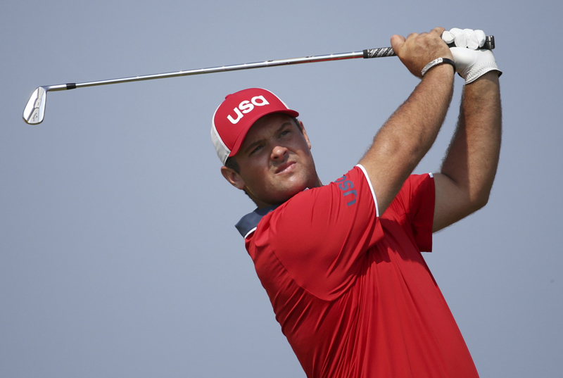 Patrick Reed (USA) of the United States hits a tee shot during practice session. Photo: Reuters