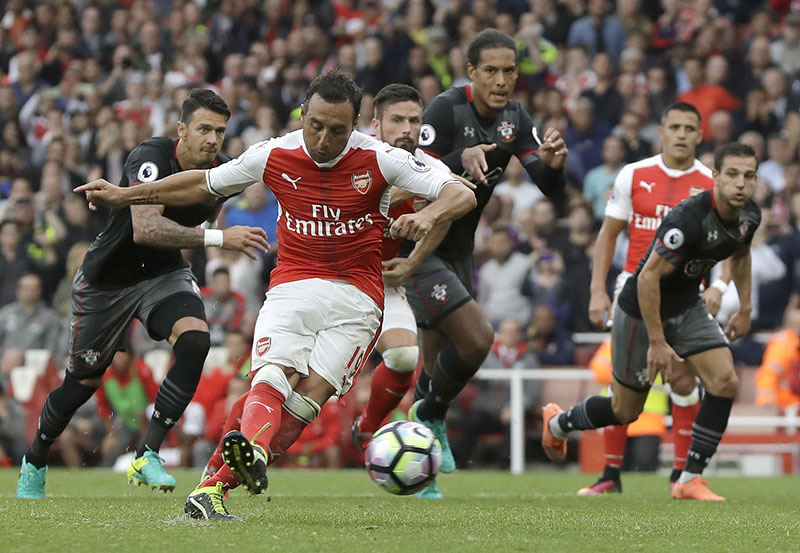 Arsenal's Santi Cazorla scores against Southampton during the English Premier League soccer match between Arsenal and Southampton at Emirates stadium in London, on Saturday, September 10, 2016. Photo: AP