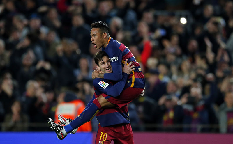 FILE - FC Barcelona's Lionel Messi (left) celebrates after scoring against Sevilla with his teammate Neymar during a Spanish La Liga soccer match at the Camp Nou stadium in Barcelona, Spain, on February 28, 2016. Photo: AP