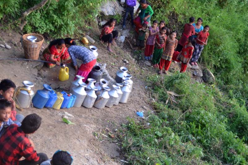 Locals of Chepang community line up to fetch water at a spout in Syamaidanda in Pida VDC in Dhading district, on Wednesday, 14 September 2016. Photo: Keshav Adhikari