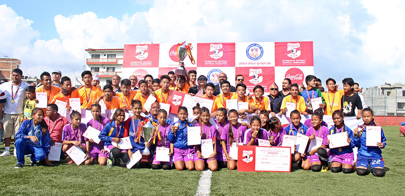 Players and officials of Chula Chuli (boys champions) and Shree Durga (girls winners) pose for a group photo after the Coca-Cola Inter-school National Football Tournament at the ANFA Complex in Lalitpur, on Tuesday, September 20, 2016. Photo: THT