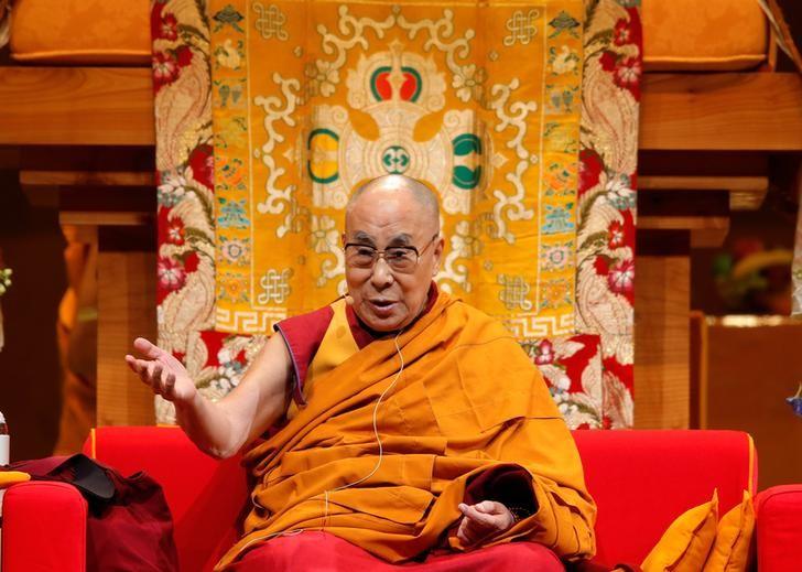 Tibet's exiled spiritual leader the Dalai Lama gestures as he gives a public religious lecture to the faithful in Strasbourg, France, September 17, 2016. REUTERS/Vincent Kessler