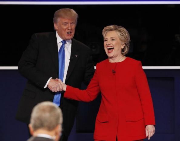 Republican U.S. presidential nominee Donald Trump shakes hands with Democratic U.S. presidential nominee Hillary Clinton at the conclusion of their first presidential debate at Hofstra University in Hempstead, New York, U.S., September 26, 2016. REUTERS/Mike Segar