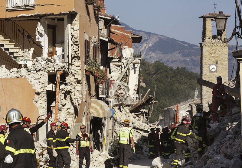 File - Firefighters work in the devastated town of Amatrice, central Italy, three days after a major earthquake on Saturday, Augut 27, 2016. Photo: ANSA via AP