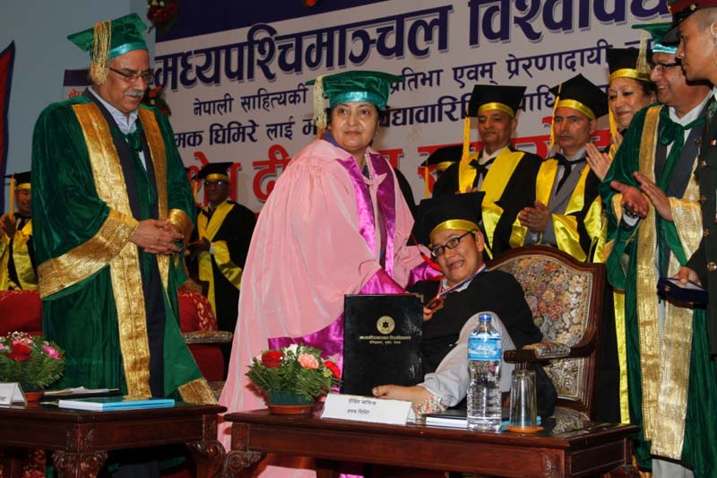 President Bidya Devi Bhandari confers the honorary PhD degree on writer Jhamak Kumari Ghimire, who is struggling with cerebral palsy, at a special convocation ceremony of Mid-Western University, in Kathmandu, on Monday, September 5, 2016. Photo: President's Office