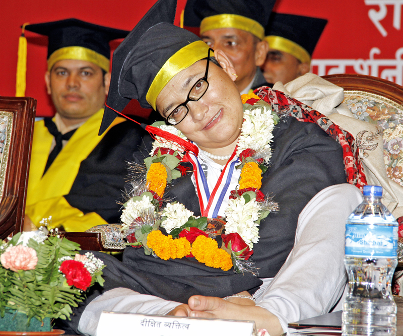 Littu00e9rateur Jhamak Kumari Ghimire being conferred on with the honorary doctorate from Mid-Western University amid a special convocation ceremony in Kathmandu, on Monday, September 5, 2016. Photo: RSS