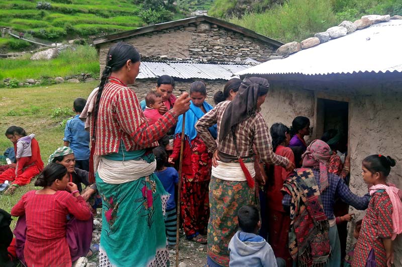Locals gather outside a health check-up at a clinic organised by the Phase Nepal in Siradi village of Kolti-4 in Bajura district, on August 31, 2016. Photo: Prakash Singh/ THT