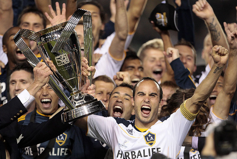 FILE - Los Angeles Galaxy forward Landon Donovan holds up the MLS Cup after they defeated the Houston Dynamo 1-0 in Carson, California, on November 20, 2011. Photo: AP