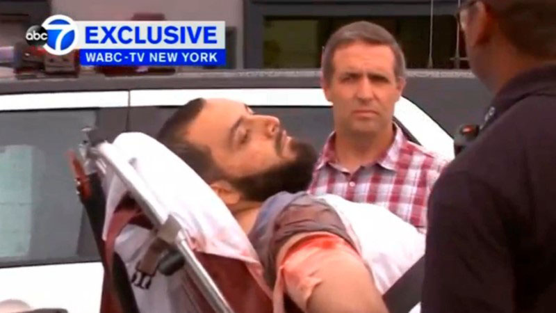 A still image captured from a video from WABC television shows a conscious man believed to be New York bombing suspect Ahmad Khan Rahami being loaded into an ambulance after a shoot-out with police in Linden, New Jersey, US, on September 19, 2016. Photo: WABC-TV via Reuters