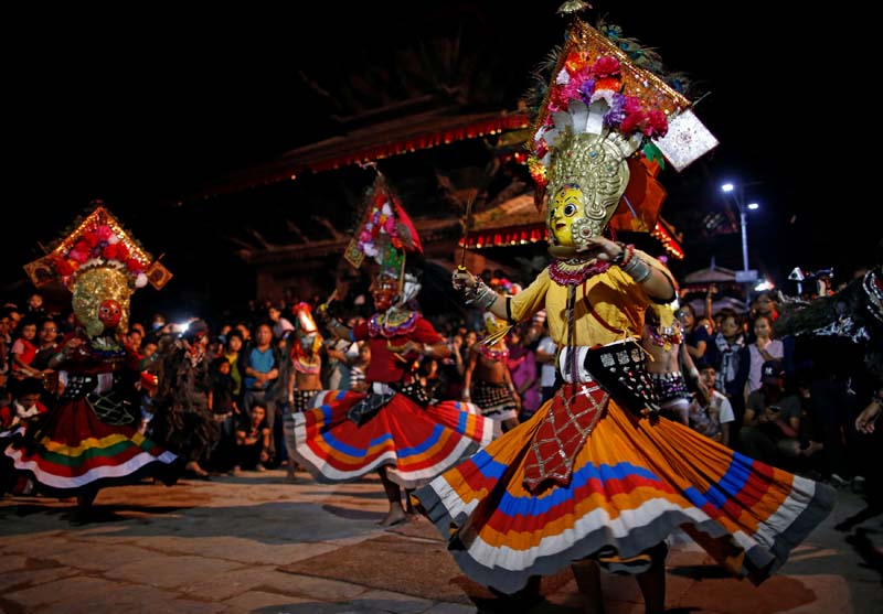 Masked dancers perform a traditional mask dance during the Indra Jatra festival in Kathmandu, on Tuesday, September 13, 2016. Photo: Reuters