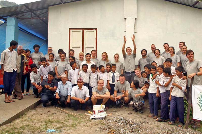 Team members of the Nepali Disaster Volunteers (NDV) after handing over the reconstructed classrooms to Shree Bal Shiksha School, in Khandichaur of Sindhupalchok district, on Friday, September 12, 2016. Photo Courtesy: NDV