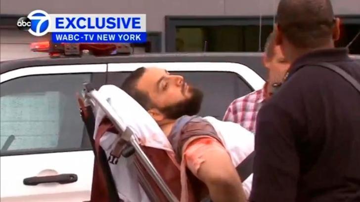 A still image captured from a video from WABC television shows a conscious man believed to be New York bombing suspect Ahmad Khan Rahami being loaded into an ambulance after a shoot-out with police in Linden, New Jersey, U.S., September 19, 2016.  Courtesy WABC-TV via REUTERS