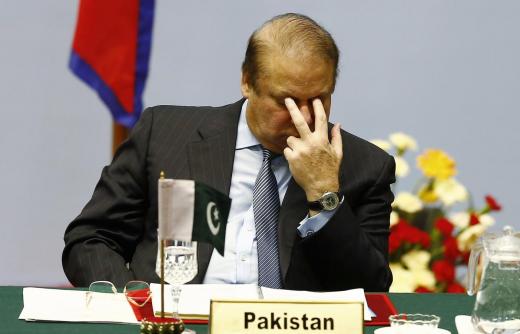 Pakistani Prime Minister Nawaz Sharif reacts as he attends the opening session of 18th South Asian Association for Regional Cooperation (SAARC) summit in Kathmandu November 26, 2014.  REUTERS/Narendra Shrestha/Pool