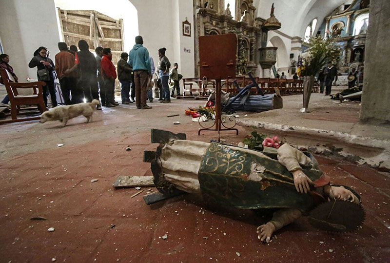 A statue of a saint lays on the floor of a church in Chivay, Peru, on Monday, August 15, 2016. Photo: Peruvian government news agency ANDINA via AP