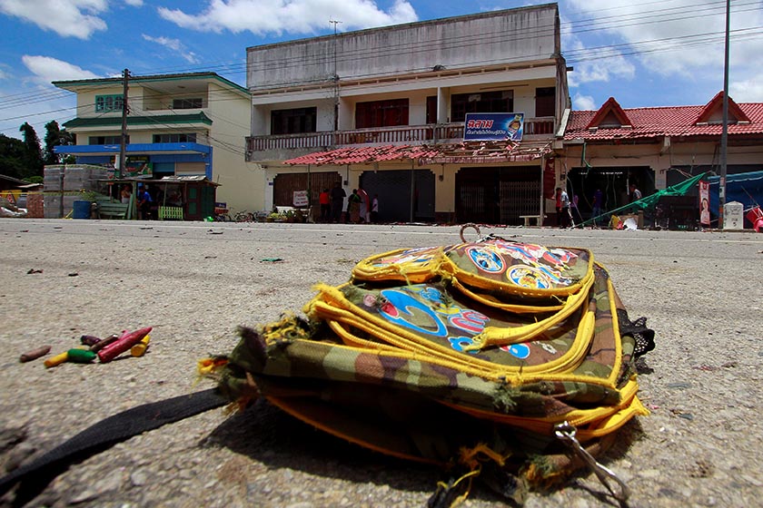 A school bag lies on a street next to the site of a bomb attack at Tak Bai district in the troubled southern province of Narathiwat