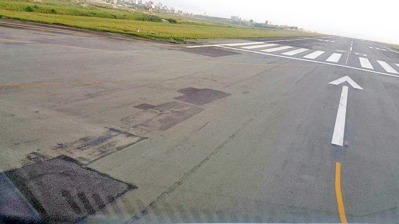 Cracks and potholes can be seen on Tribhuvan International Airport runway, raising safety concerns, on Thursday, September 15, 2016. Photo: THT