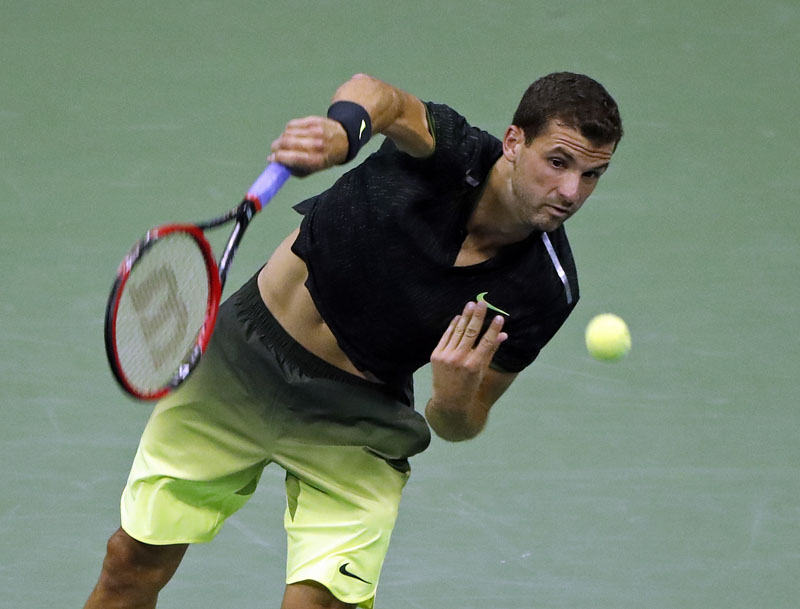 Grigor Dimitrov, of Bulgaria, serves to Andy Murray, of Britain, at the US Open tennis tournament, on Monday, September 5, 2016, in New York. Photo: AP