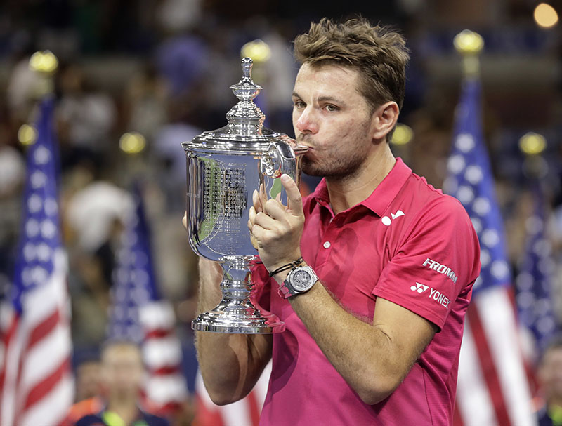 Stan Wawrinka, of Switzerland, holds up the championship trophy after beating Novak Djokovic, of Serbia, to win the men's singles final of the US Open tennis tournament, on Sunday, September 11, 2016, in New York. Photo: AP