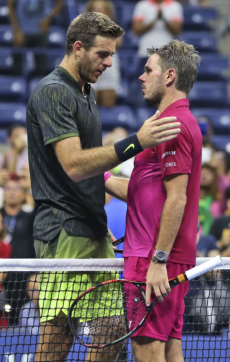 Stan Wawrinka (right) of Switzerland (right) and Juan Martin del Potro, of Argentina, meet at the net after Wawrinka's 7-6 (5), 4-6, 6-3, 6-2 win in the quarterfinals of the US Open tennis tournament, on Thursday, September 8, 2016, in New York. Photo: AP