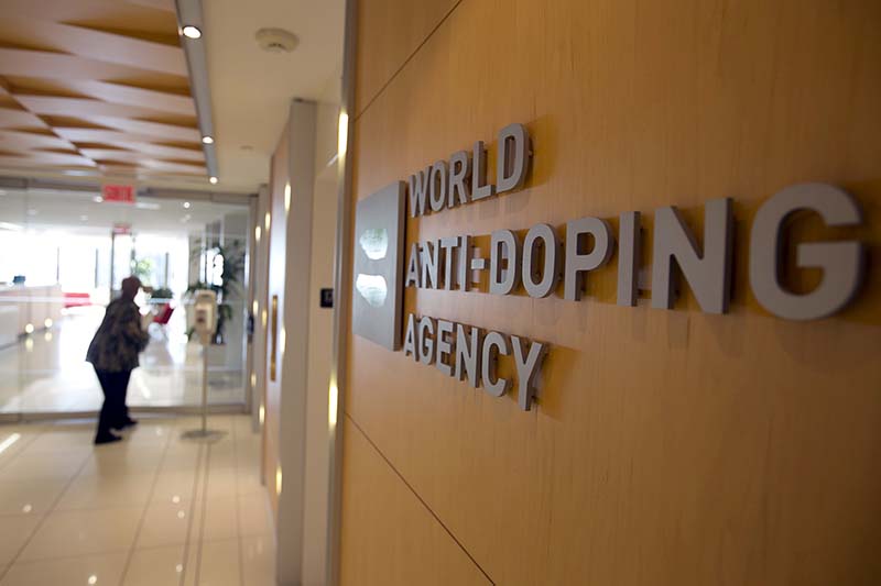 A woman walks into the head office of the World Anti-Doping Agency (WADA) in Montreal, Quebec, Canada on November 9, 2015. Photo: Reuters