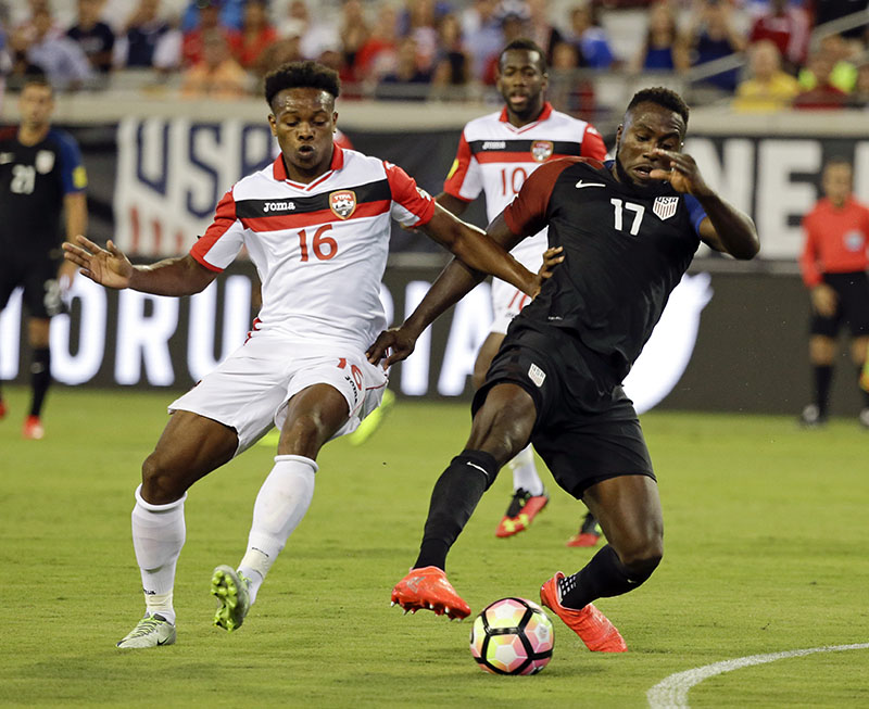Trinidad &amp; Tobago's Levi Garcia (16) and United States' Jozy Altidore (17) battle for possession of the ball during the first half of a CONCACAF World Cup qualifying soccer match, on Tuesday, September 6, 2016, in Jacksonville, Florida. Photo: AP
