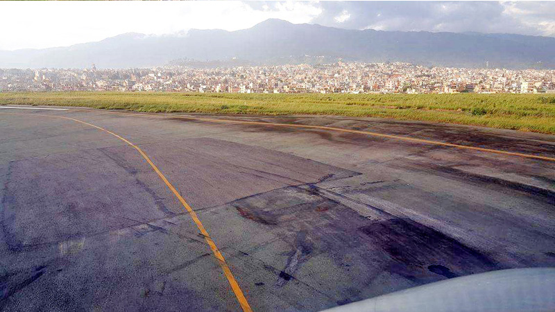Cracks and potholes can be seen on Tribhuvan International Airport runway, raising safety concerns, on Thursday, September 15, 2016. Photo: THT