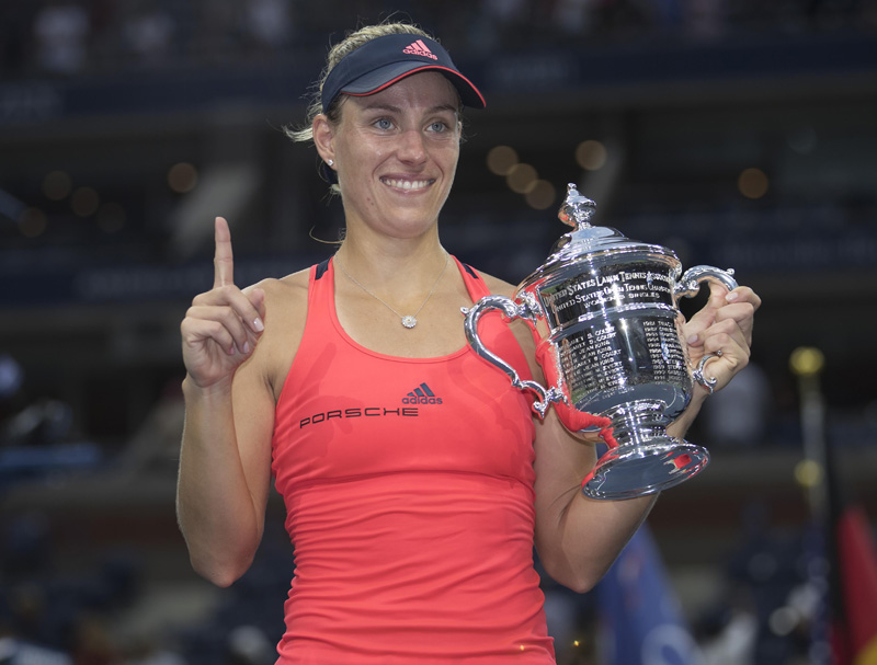 Angelique Kerber (GER) poses with the trophy after her match against Karolina Pliskova (CZE) on day thirteen of the 2016 US Open tennis tournament at USTA Billie Jean King National Tennis Center. Mandatory Credit: Susan Mullane-USA TODAY Sports