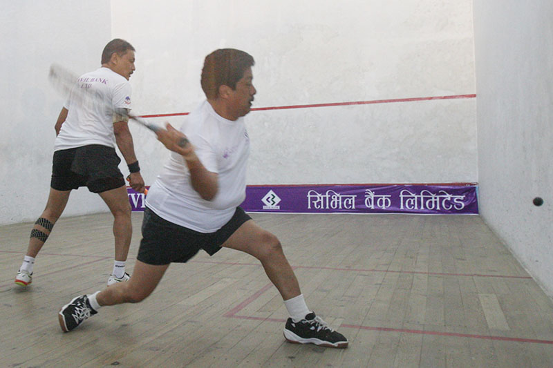 Amar Keshar Singh (right) plays a shot against Kishor Maharjan during the fourth Civil Bank Open Squash Championship in Lalitpur, on Tuesday, October 18, 2016. Photo: Udipt Singh Chhetry/THT