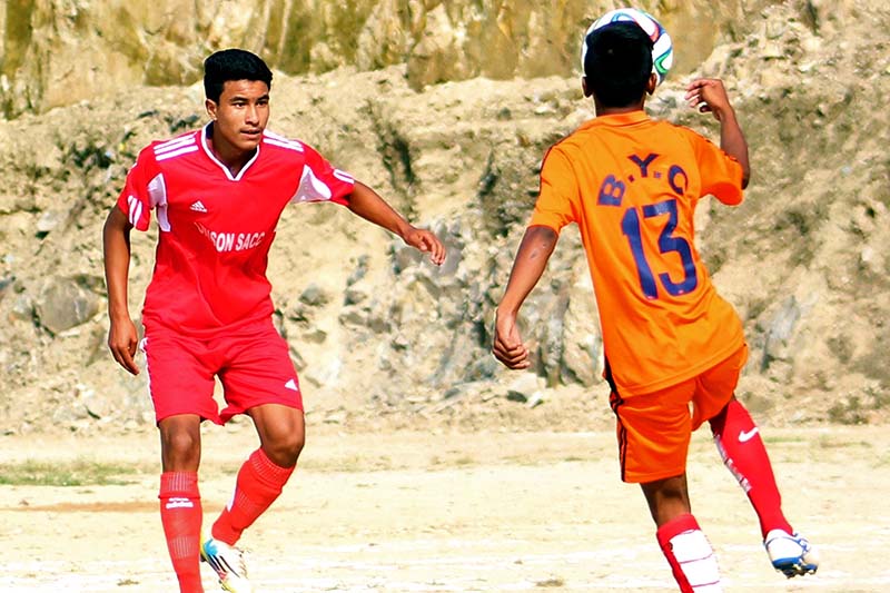 Arik Bista of Tarakeshwor Youth Club (left) vies for the ball with Rohit Giri of Janachahana during their Naikap Gold Cup match in Kathmandu on Saturday, October 15, 2016. Photo Courtesy: Subas Humagain