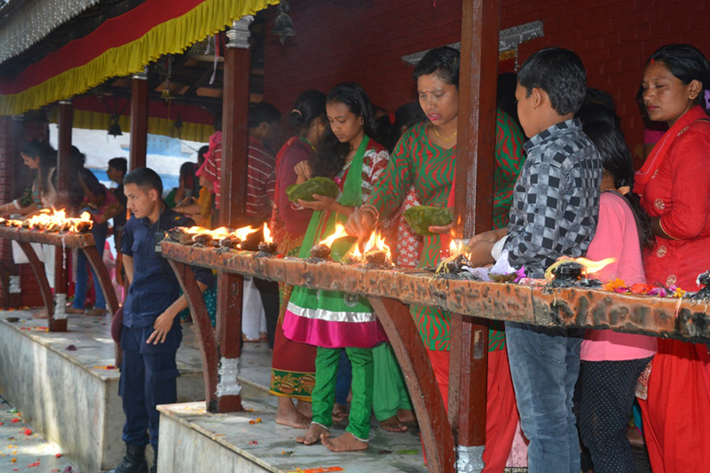 Devotees light oil lamps at the Kalika Temple in Baglung district, on Sunday, October 9, 2016. People from the district and around throng the temple during the Dashain festival. Photo: RSS