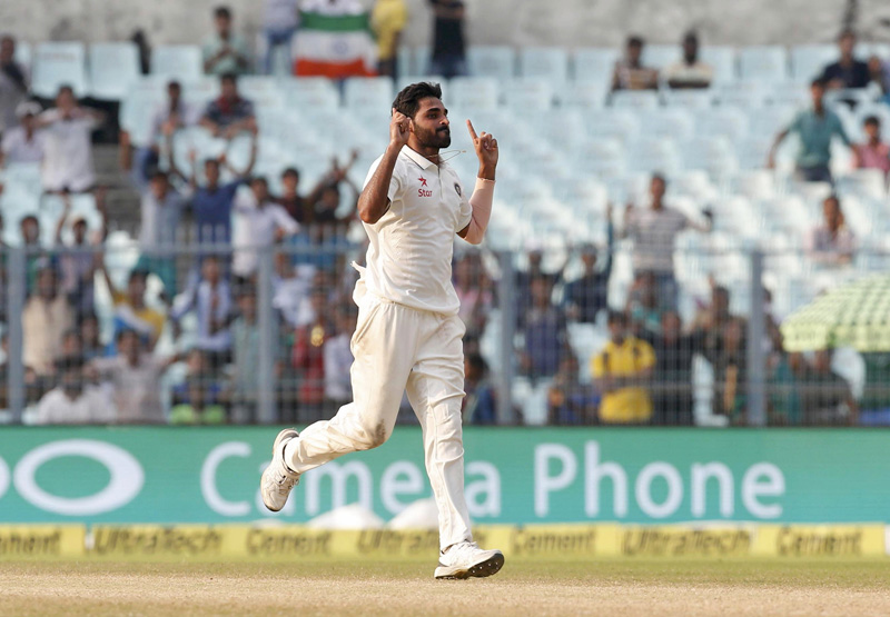 India's Bhuvneshwar Kumar celebrates taking the wicket of New Zealand's batsman. Photo: Reuters