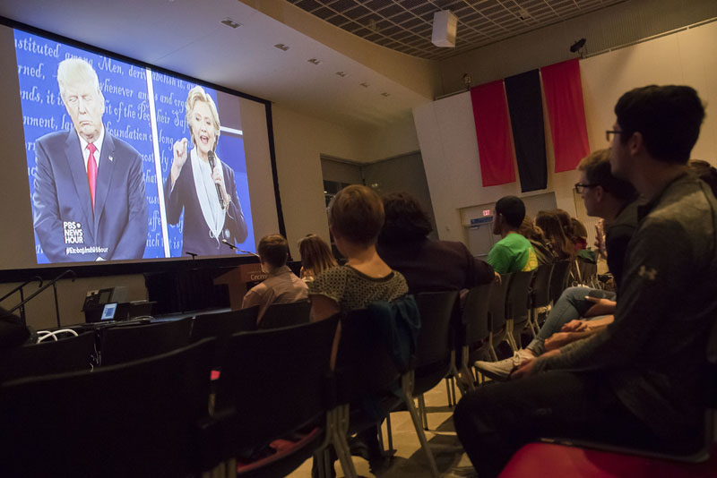 Republican presidential nominee Donald Trump, (left) and Democratic presidential nominee Hillary Clinton are displayed on a big screen as viewers watch the second Presidential debate during a watch party at the University of Cincinnati, on Sunday, October 9, 2016, in Cincinnati. Photo: AP