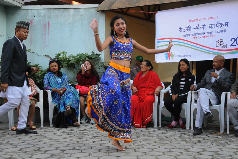 A girl performs a dance during a Deusi-Bhailo programme organised by the National Forum of Photo Journalists (NFPJ) at Maitidevi in Kathmandu on Sunday, October 30, 2016. Photo: NFPJ