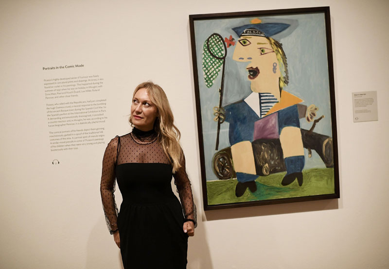 Diana Widmaier Picasso, grand-daughter of Pablo Picasso, poses beside a 1938 portrait of her mother entitled 'Maya in a Sailor Suit' at the National Portrait Gallery in London, Britain, on October 5, 2016. Photo: Reuters