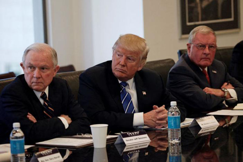 Republican presidential nominee Donald Trump sits with U.S. Senator Jeff Sessions (R-AL) (L) and retired U.S. Army General Keith Kellogg (R) during a national security meeting with advisors at Trump Tower in Manhattan, New York, US, on October 7, 2016. Photo: Reuters