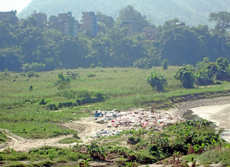 Garbage dumped on the banks of the Madi River at Bhateri, in Tanahun, on Sunday, October 16, 2016. Photo: THT