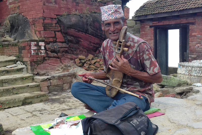 A local Gandarbha (traditional musician) plays the Malashree tune with his sarangi, at the Gorkha Durbar of Gorkha district, on Sunday, October 9, 2016. The tune is especially played during the Dashain festival. Photo: RSS