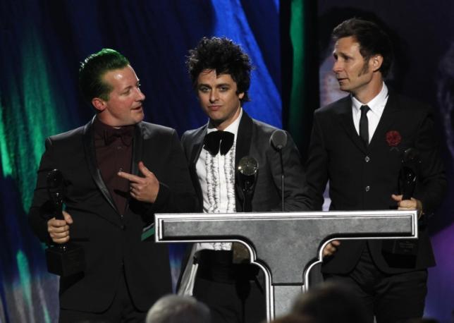 Members of the band Green Day react as they are inducted during the 2015 Rock and Roll Hall of Fame Induction Ceremony in Cleveland, Ohio April 18, 2015. REUTERS/Aaron Josefczyk